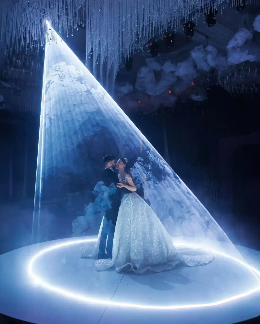 Laser show at a wedding - one beam over two people