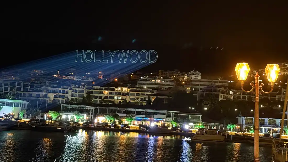HOLLYWOOD laser lettering over Sveti Vlas, seen from the marina, during a wedding