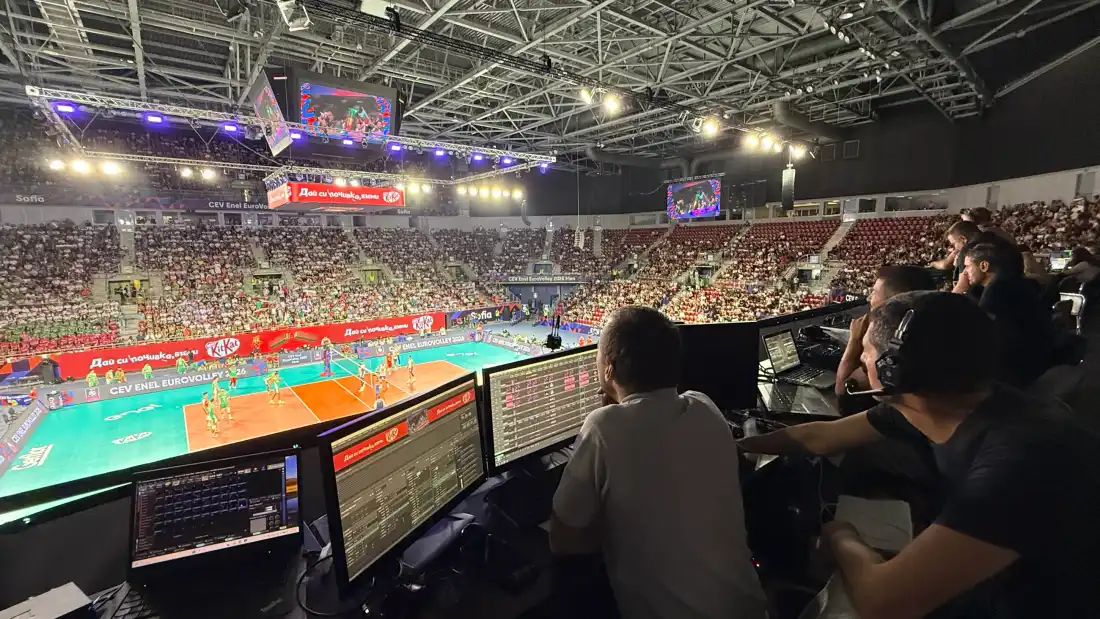 The KVANT crew at their positions in Arena 8888 during a match - monitors with the content, the court and the full hall in front of them