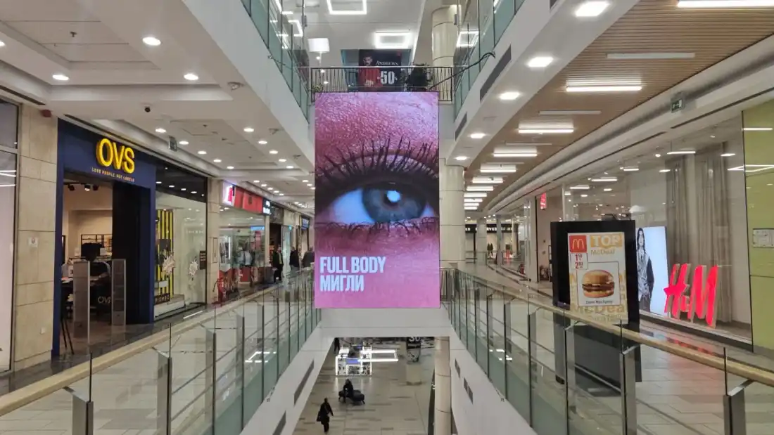 Double-sided P2 LED screen hanging in the atrium of The Mall, with shops on both sides